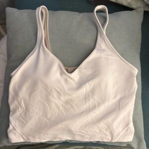 Lululemon white sports bra size small. Has removable pads.